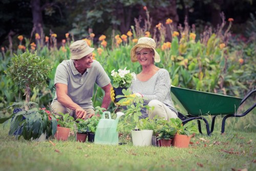 Team member sorting garden waste into bins at the start of a sustainable garden job